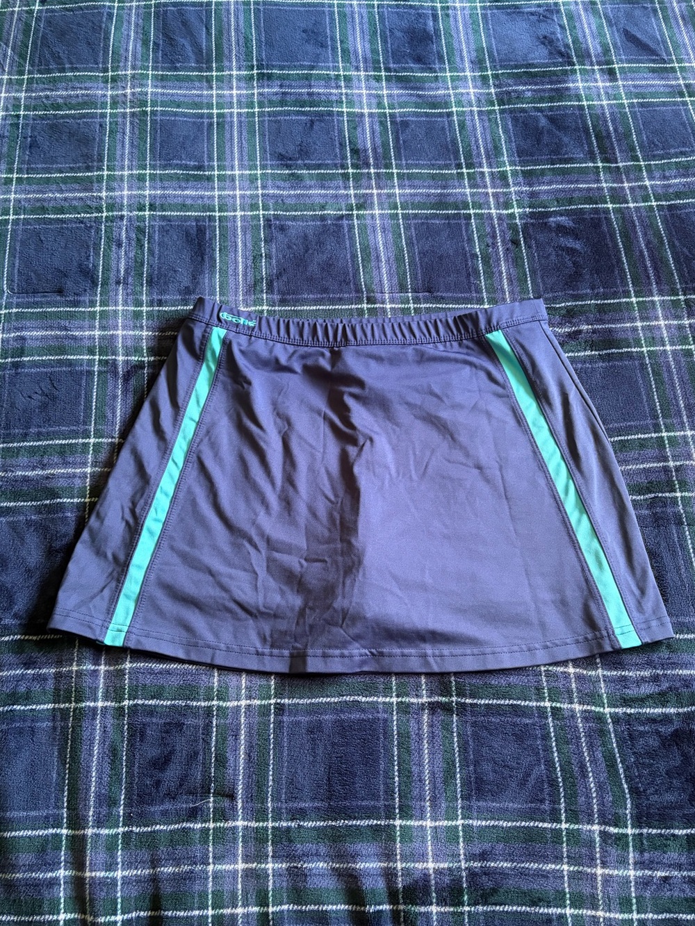 bolle sport Golf navy blue tennis skort with teal side stripes. Size M.